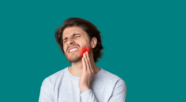 A Man Experiencing a Dental Emergency